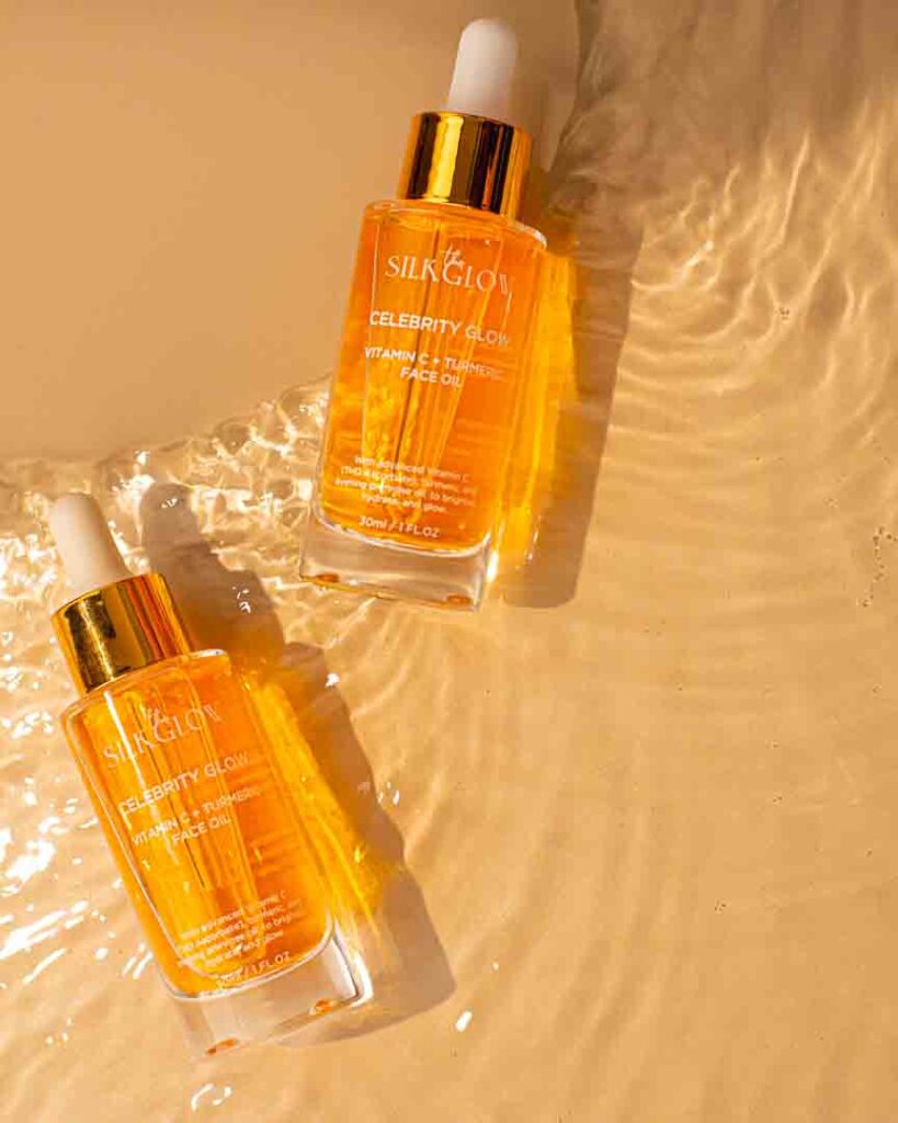 Skincare oil bottles placed in water as the background to share the message of the natural ingredients used for this product.